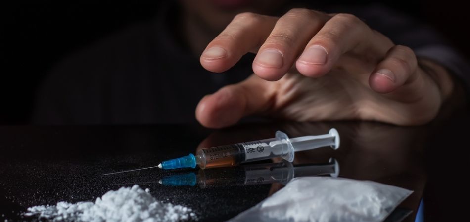 Man reaching for heroin