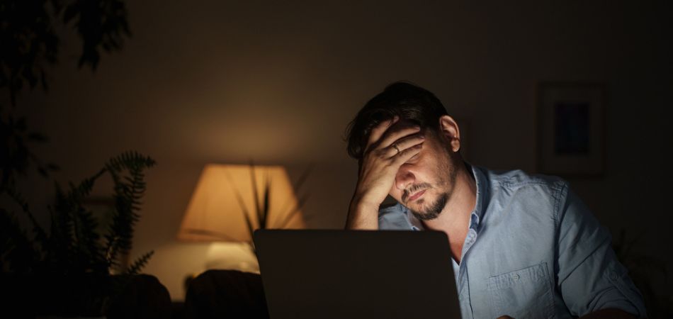 Man suffring with headache because of his promethazine addiction