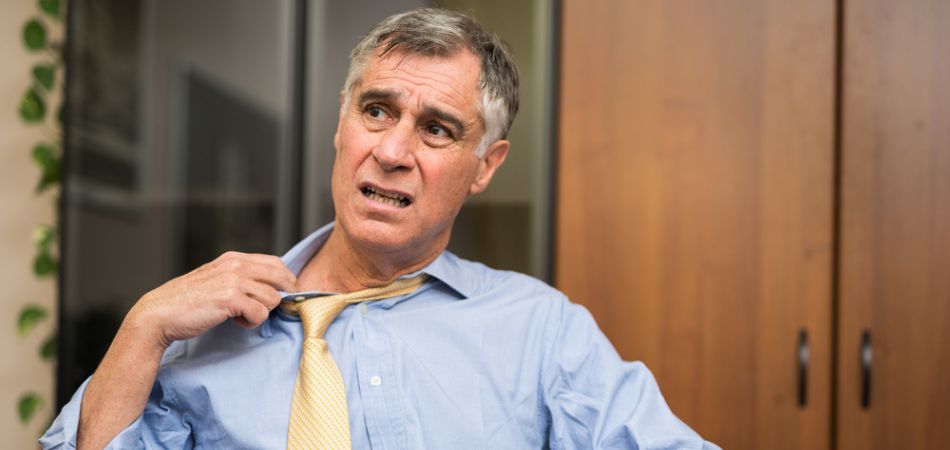 business man sweating in office - Providence Projects Rehab Centre